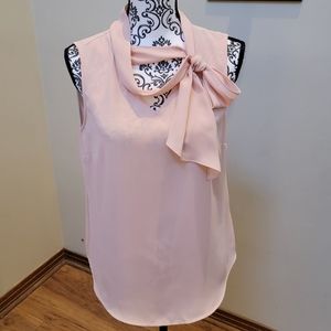 DKNY New without tags. Blush pink sleeveless top. Size M